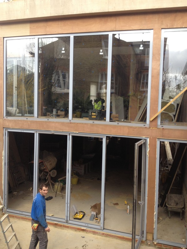 Aluminium bi-fold doors with two-storey glazing in Chesham