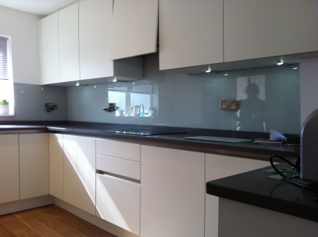 Grey glass kitchen splashback with LED lighting in Chesham
